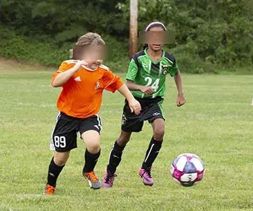Girls playing recreational soccer