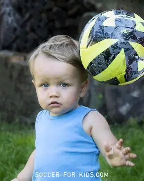 Toddler heading the soccer ball