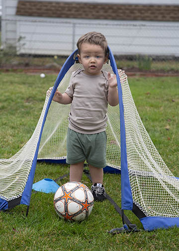 Toddler inside soccer goals
