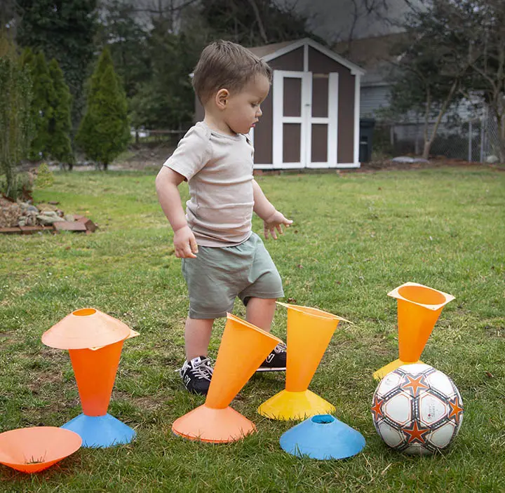 2 year old playing with soccer ball