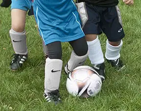 Toddler with shin guards