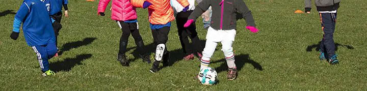 Youth soccer legs running